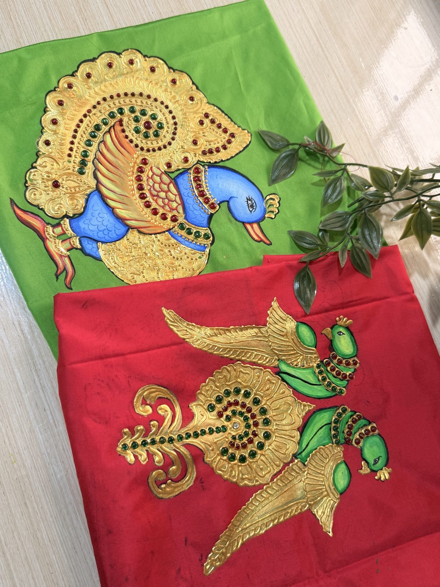 Peacock Tanjore fabric painting on green and red cloth